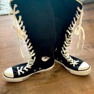 Chuck Taylor knee-high shoes.